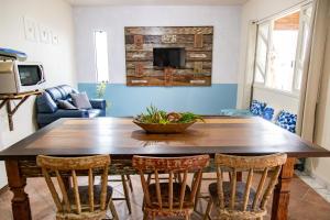 Aptos exclusivos com varanda ou terraço com Pôr do sol, cozinha privativa e equipada, Wi-Fi 600MBs, a 700m da praia de Itapirubá e 1km da BR-101