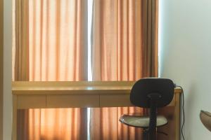 Comfy and Homey Studio Room at Grand Kamala Lagoon Apartment By Travelio