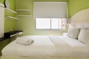 Cozy Stay 2BR Marina Ancol Apartment By Travelio