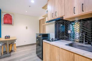 Simply 1BR Apartment at Pejaten Park Residence By Travelio