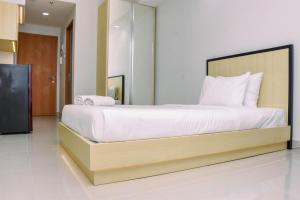 Cozy Studio with Single Bed at Evenciio Margonda Apartment By Travelio