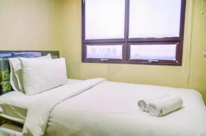 Nice and Cozy 2BR Apartment at Atria Residence Gading Serpong By Travelio