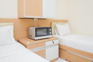 Compact Studio No Kitchen Apartment at Aeropolis Residence By Travelio