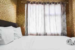 Luxurious and Comfy 2BR at Vida View Makassar Apartment By Travelio