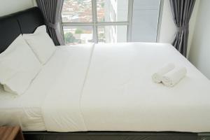 Simply and Cozy 3BR Apartment at M-town Residence By Travelio