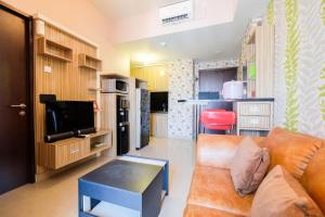 Cozy 1BR Apartment with Workspace at Mustika Golf Residence By Travelio