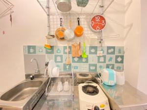 Cozy Studio Room at Grand Asia Afrika Apartment By Travelio