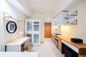 New and Nice Studio at Evenciio Margonda Apartment By Travelio