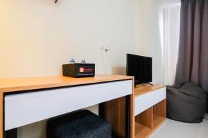 New and Nice Studio at Evenciio Margonda Apartment By Travelio
