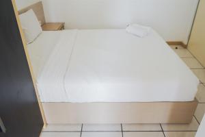 Simple and Cozy 2BR Apartment at M-Town Residence By Travelio