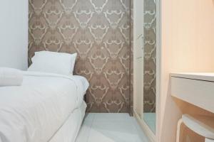 Cozy Stay at 2BR Green Pramuka City Apartment near Shopping Center By Travelio