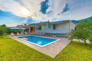 Family-Friendly Holiday Home with Private Pool, Playground, and BBQ