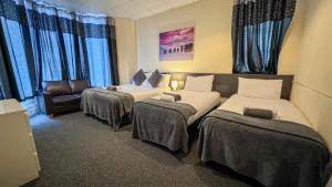 Family Room with Side Sea View room in The Ascot Hotel