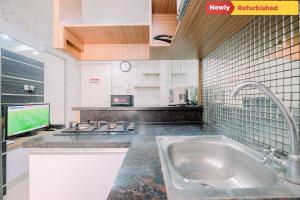 Cozy Stay 2BR Green Bay Pluit Apartment By Travelio
