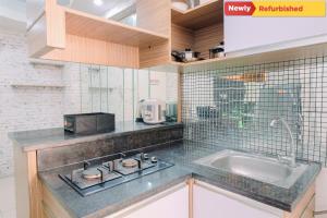 Cozy Stay 2BR Green Bay Pluit Apartment By Travelio