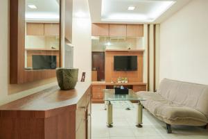 Homey and Compact 2BR Mediterania Marina Ancol Apartment By Travelio
