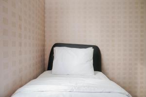 Homey and Compact 2BR Mediterania Marina Ancol Apartment By Travelio