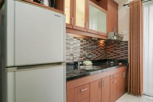 Homey and Compact 2BR Mediterania Marina Ancol Apartment By Travelio