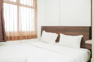 Spacious and Nice 2BR Serpong Greenview Apartment By Travelio