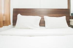 Spacious and Nice 2BR Serpong Greenview Apartment By Travelio