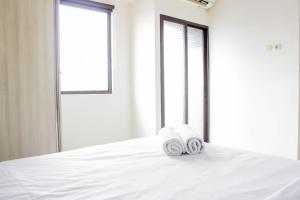 Spacious & Deluxe 2BR Gateway Ahmad Yani Cicadas Apartment By Travelio