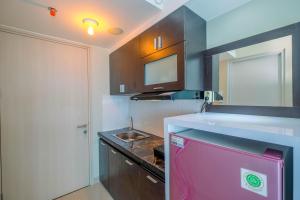 Pool View Studio Apartment @ Springlake Summarecon Bekasi By Travelio