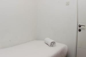 Comfy and Tranquil 2BR Bassura City Apartment near Mall By Travelio
