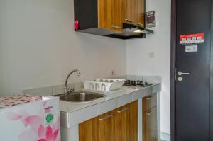 Compact and Modern Studio Room at Casa De Parco Apartment By Travelio