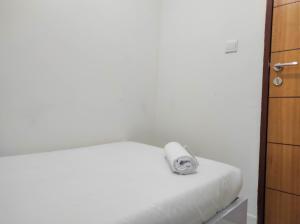 Homey and Comfy 2BR at Vida View Apartment By Travelio