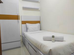 Homey and Comfy 2BR at Vida View Apartment By Travelio