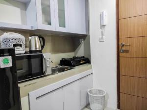 Homey and Comfy 2BR at Vida View Apartment By Travelio