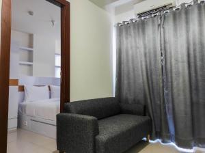 Homey and Comfy 2BR at Vida View Apartment By Travelio
