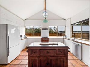 Pelicans View a Riverside Retreat