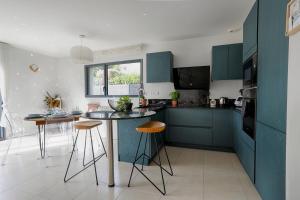 Villas Maison neuve & lumineuse avec jacuzzi privatif : photos des chambres