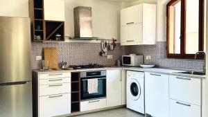 Marcelli, delizioso trilocale con giardino - M409