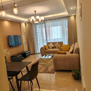 Enzi heights luxurious 2 bedroom furnished and serviced apartment with a pool,gym and playground