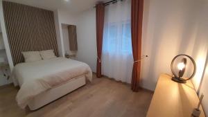 Appartements L-Olivaie - Calme, confort et vue imprenable : photos des chambres