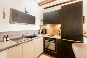 Appartements Escapade medievale Charme et Authenticite : photos des chambres