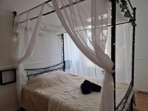 Appartements Spa et lit baldaquin : photos des chambres