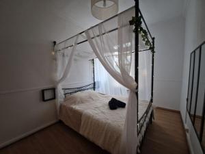 Appartements Spa et lit baldaquin : photos des chambres