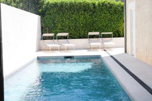 Appartements NUXIA Suites&SPA L-Aboheme Chic : photos des chambres