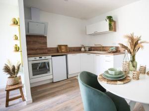 Appartements NUXIA Suites&SPA L-Aboheme Chic : photos des chambres