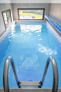 Villas La villa sur la baie vue imprenable et piscine interieure 29 degres : photos des chambres