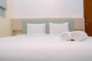 Warm and Cozy 2BR Signature Park Grande Apartment By Travelio