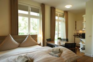 Villa Schmidt Apartments - Strandhaus direkt am Meer mit Sauna, Sport und Dünengarten - Komfort