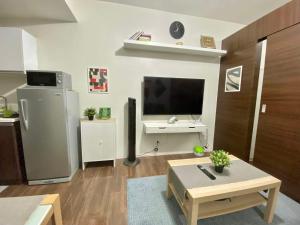 Cozy 1-BR Flat in Air Residences Makati