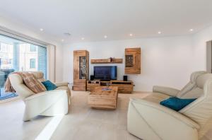 Pusteblume - Barrierefreie 5-Sterne-Ferienwohnung mit Seeblick und Sauna