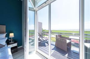 Ostseestern - 5-Sterne Ferienwohnung mit Südbalkon am Bodden