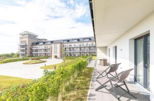 5 Sterne Ferienwohnung Boddenkieker mit großer Eckterrasse und Boddenblick