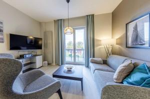 Boddenzeit - Moderne Ferienwohnung mit Nordbalkon, Wellnessbereich und Nähe zum Ostseestrand
